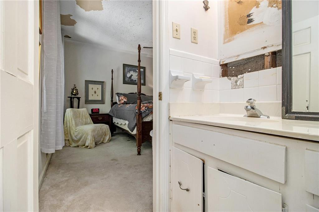 2367 Henderson Mill Road, Unit 8 Atlanta, GA 30345 - Photo 20 of 35 a en suite bathroom with a sink double vanity and a mirror