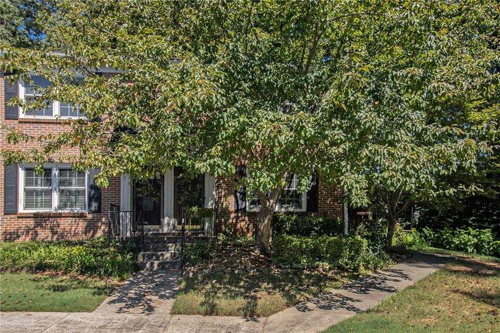 2367 Henderson Mill Road, Unit 8 Atlanta, GA 30345 - Photo 2 of 35 a view of a house with a tree