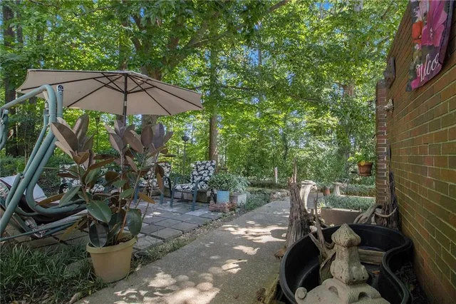 a view of a chair and tables in the patio