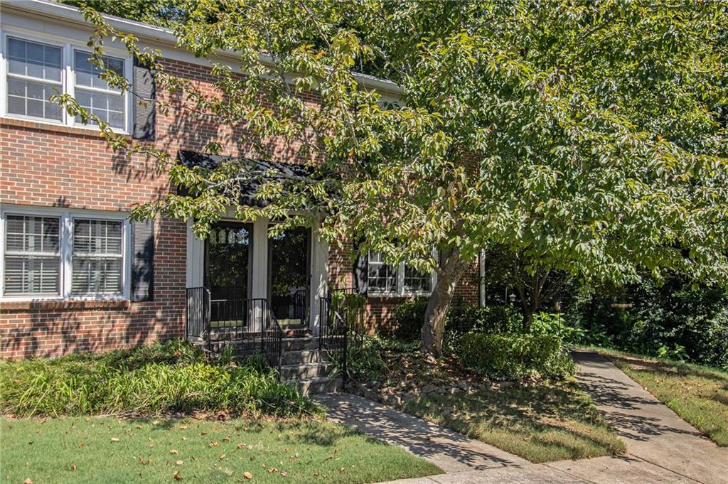 2367 Henderson Mill Road, Unit 8 Atlanta, GA 30345 - Photo 32 of 35 a view of a house with a tree