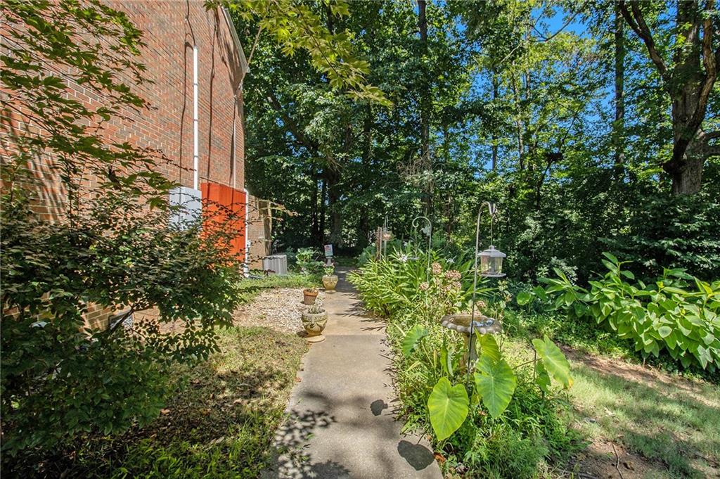 2367 Henderson Mill Road, Unit 8 Atlanta, GA 30345 - Photo 35 of 35 a backyard of a building with trees