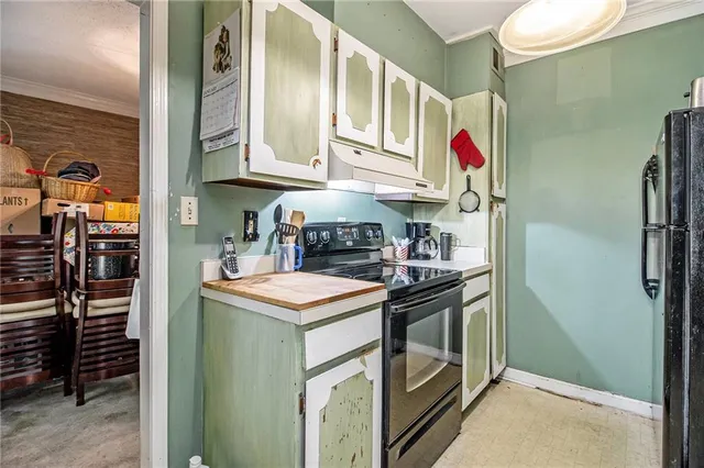 a kitchen with stainless steel appliances granite countertop a sink and cabinets