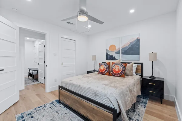 a bedroom with a bed and a chair