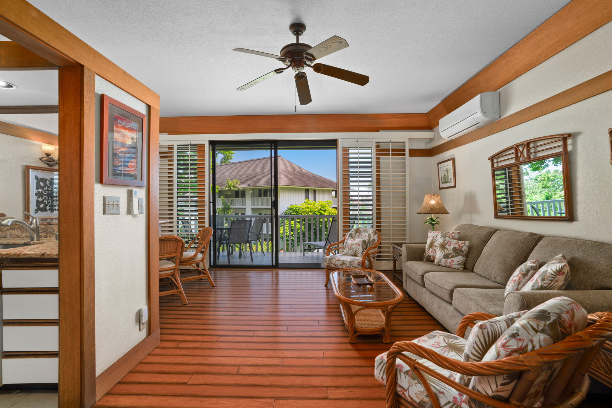 2253 Poipu Road, Unit 330 Koloa, HI 96756 - Photo 10 of 26 a living room with furniture and a large window with wooden floor