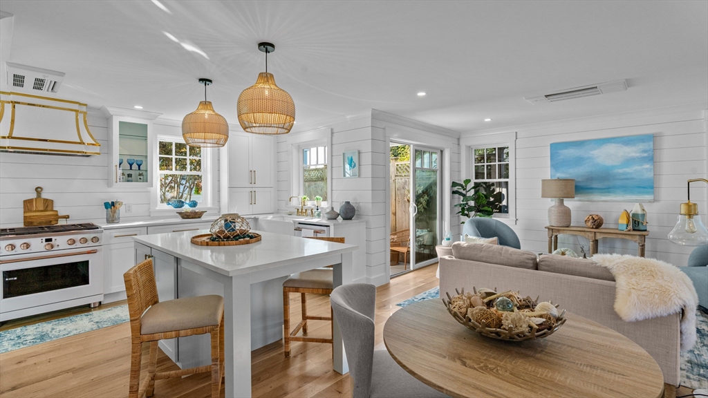 39 Connection Street Newport, RI 02840 - Photo 19 of 40 a living room with furniture dining table and wooden floor