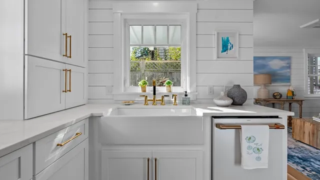 a stove top oven sitting inside of a kitchen