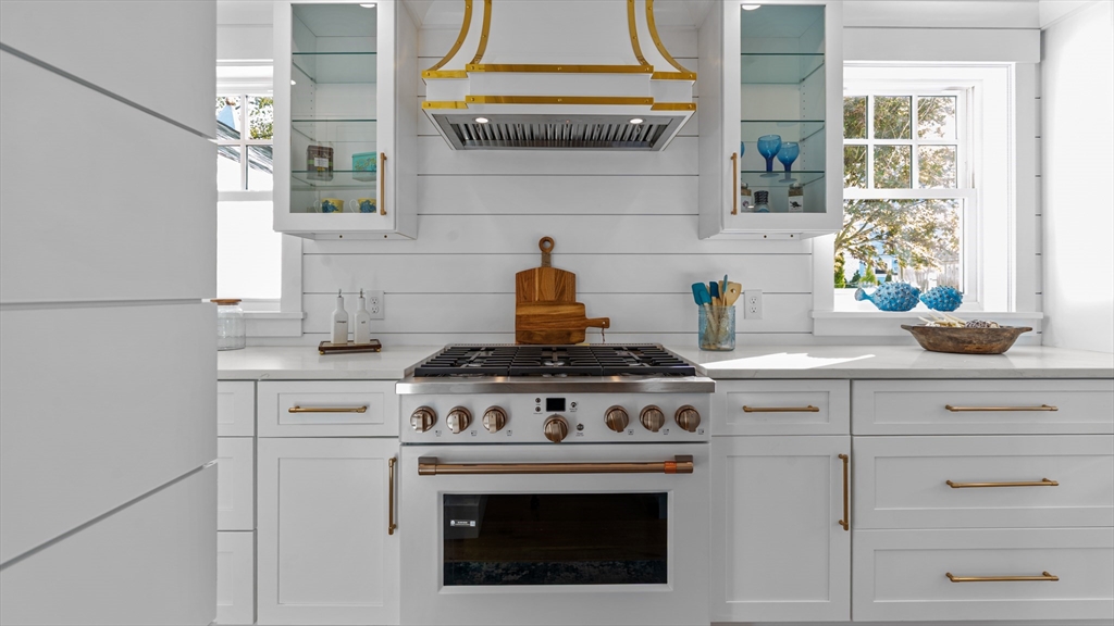 39 Connection Street Newport, RI 02840 - Photo 21 of 40 a stove top oven sitting inside of a kitchen