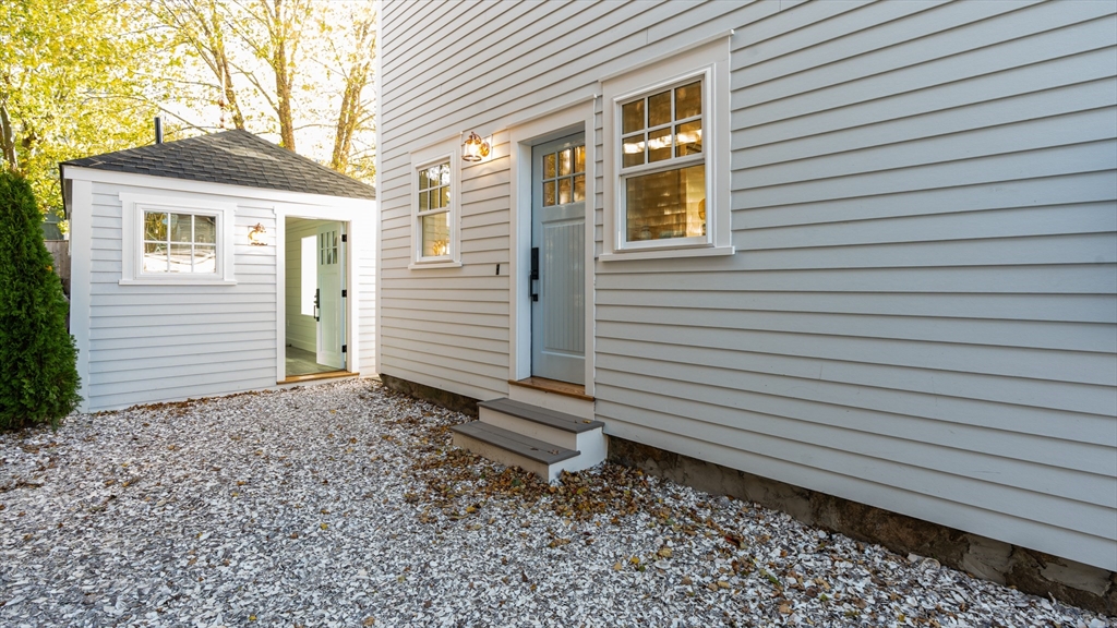 39 Connection Street Newport, RI 02840 - Photo 30 of 40 a view of a house with a yard and a large window