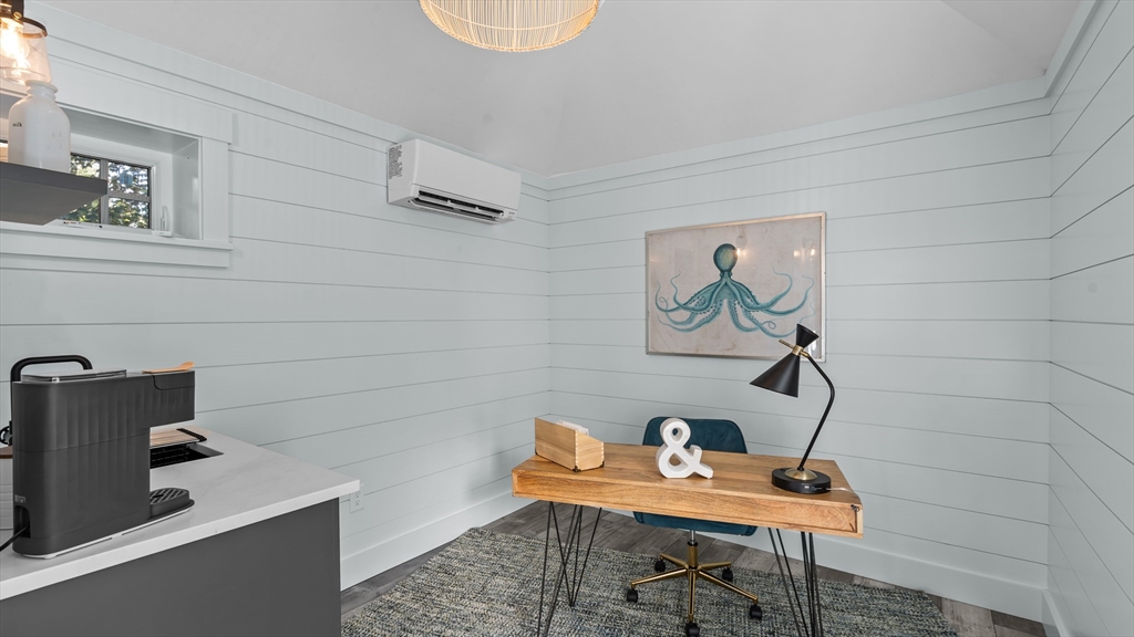 39 Connection Street Newport, RI 02840 - Photo 31 of 40 a workspace with furniture and lamp