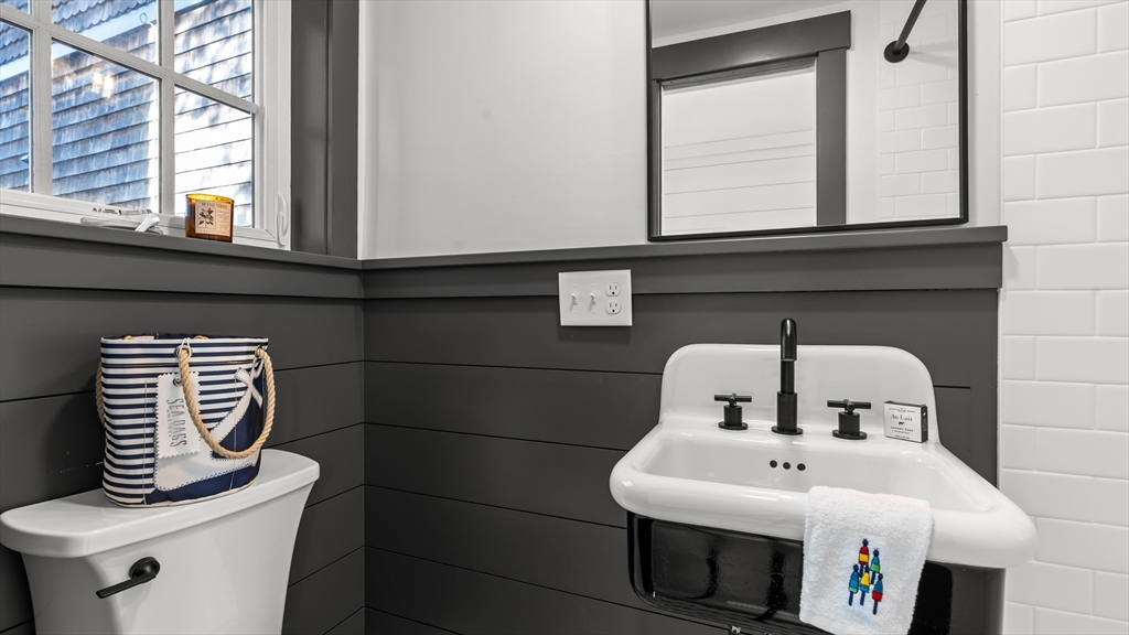 39 Connection Street Newport, RI 02840 - Photo 36 of 40 a bathroom with a sink and a mirror