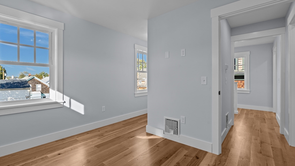 39 Connection Street Newport, RI 02840 - Photo 8 of 40 a view of an empty room and wooden floor