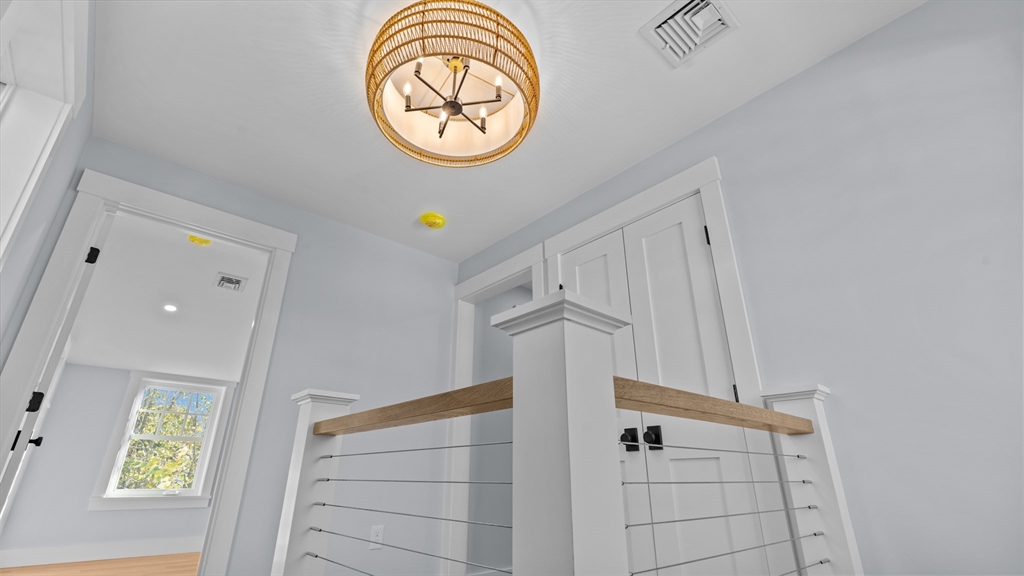 39 Connection Street Newport, RI 02840 - Photo 10 of 40 a view of entryway with a window and a mirror