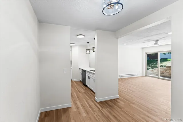 a view of a kitchen from the hallway