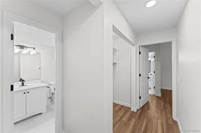 a view of a bathroom from a hallway
