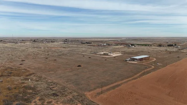 a view of a big yard with wooden floor