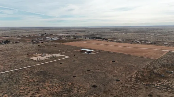 a terrace with a table and chairs