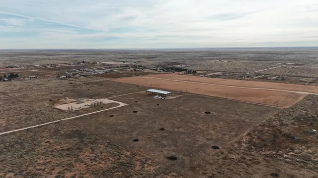a terrace with a table and chairs