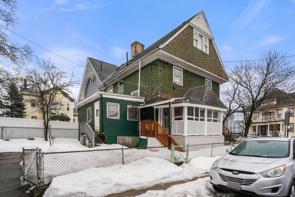 1 Copley Street Boston, MA 02119 - Photo 2 of 29 a front view of a house with a yard