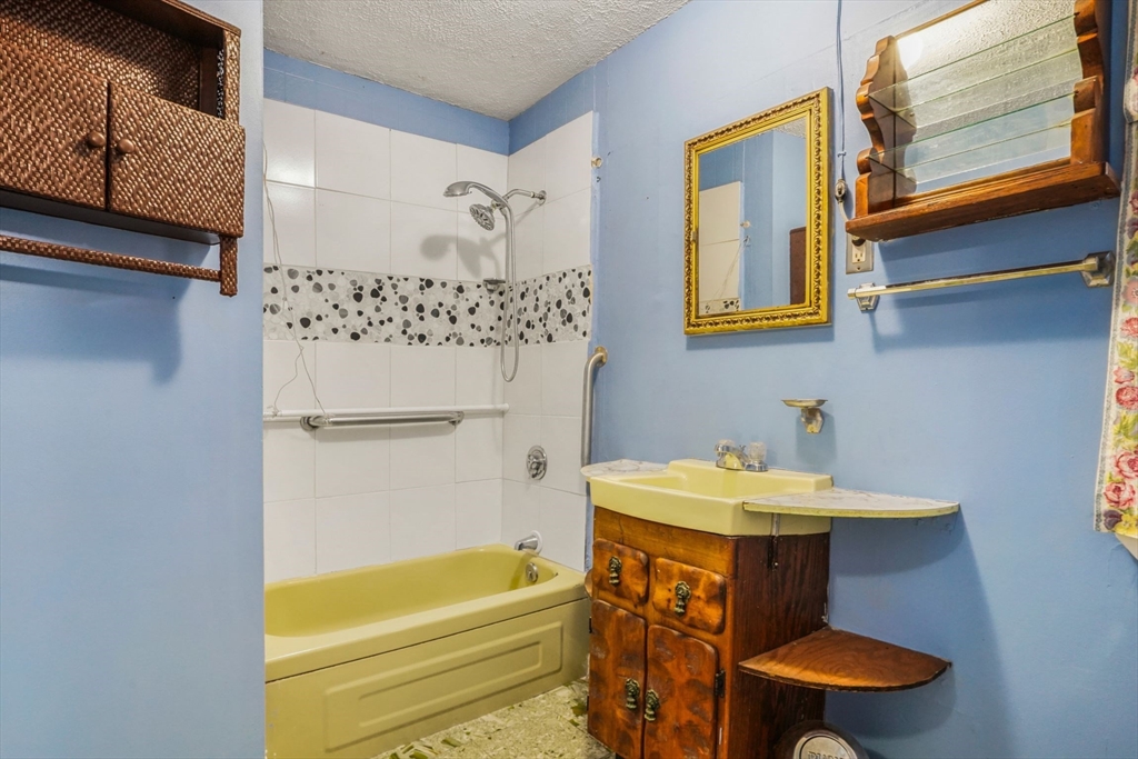 1 Copley Street Boston, MA 02119 - Photo 22 of 29 a bathroom with a sink and a bathtub