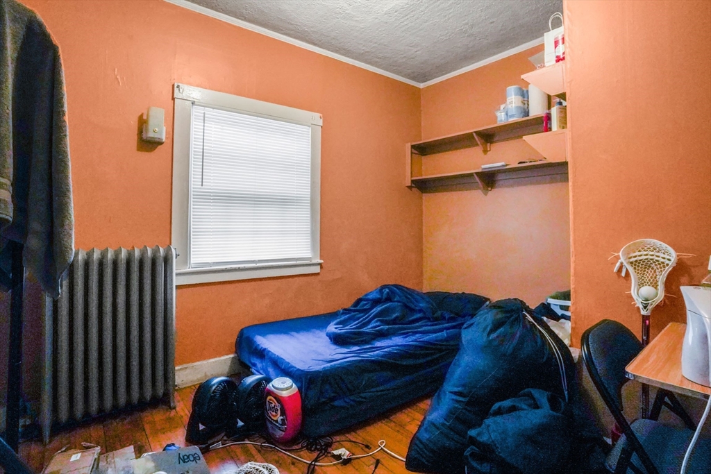 1 Copley Street Boston, MA 02119 - Photo 25 of 29 a living room with furniture and a window
