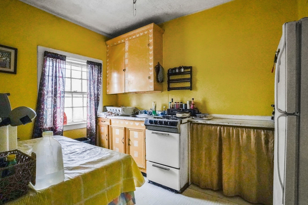 1 Copley Street Boston, MA 02119 - Photo 26 of 29 a bed room with a bed furniture and a window