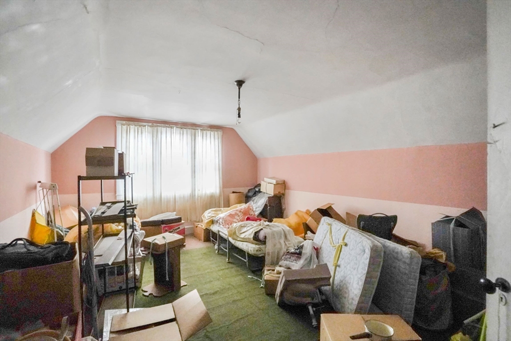 1 Copley Street Boston, MA 02119 - Photo 27 of 29 a living room with furniture and a floor to ceiling window