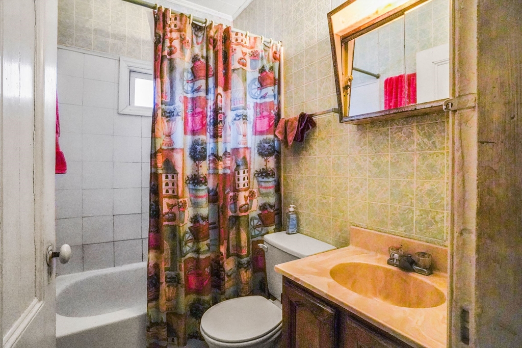 1 Copley Street Boston, MA 02119 - Photo 29 of 29 a bathroom with a sink toilet and shower