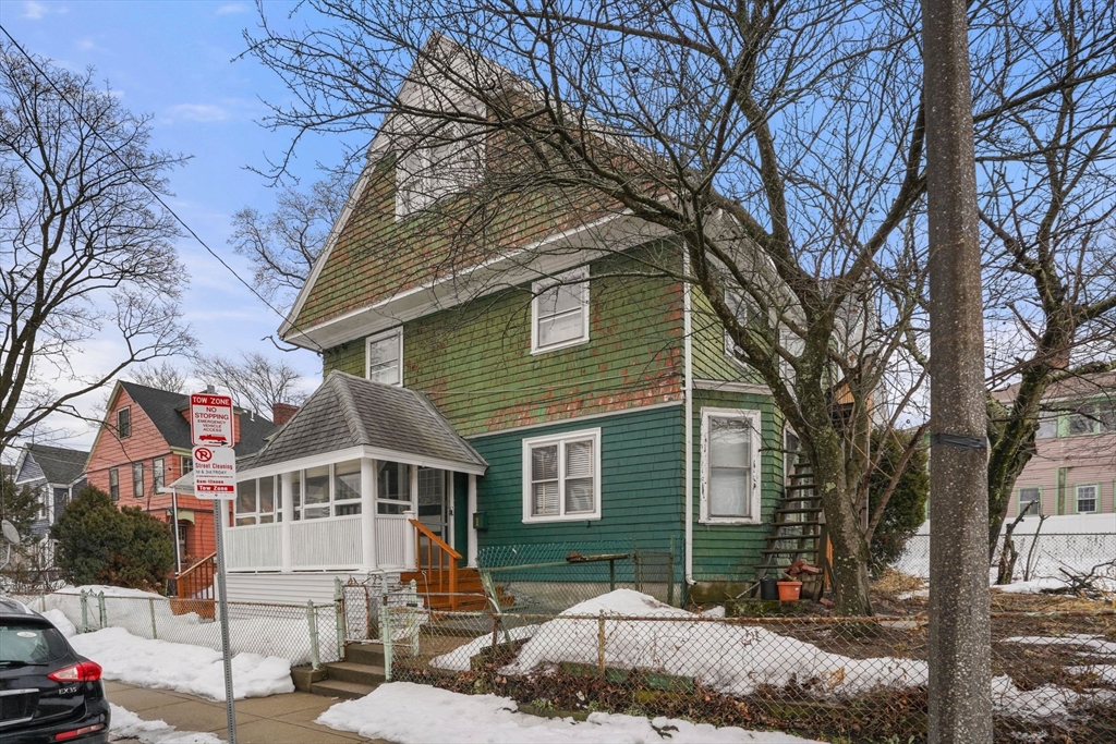 1 Copley Street Boston, MA 02119 - Photo 3 of 29 a front view of a house with a yard