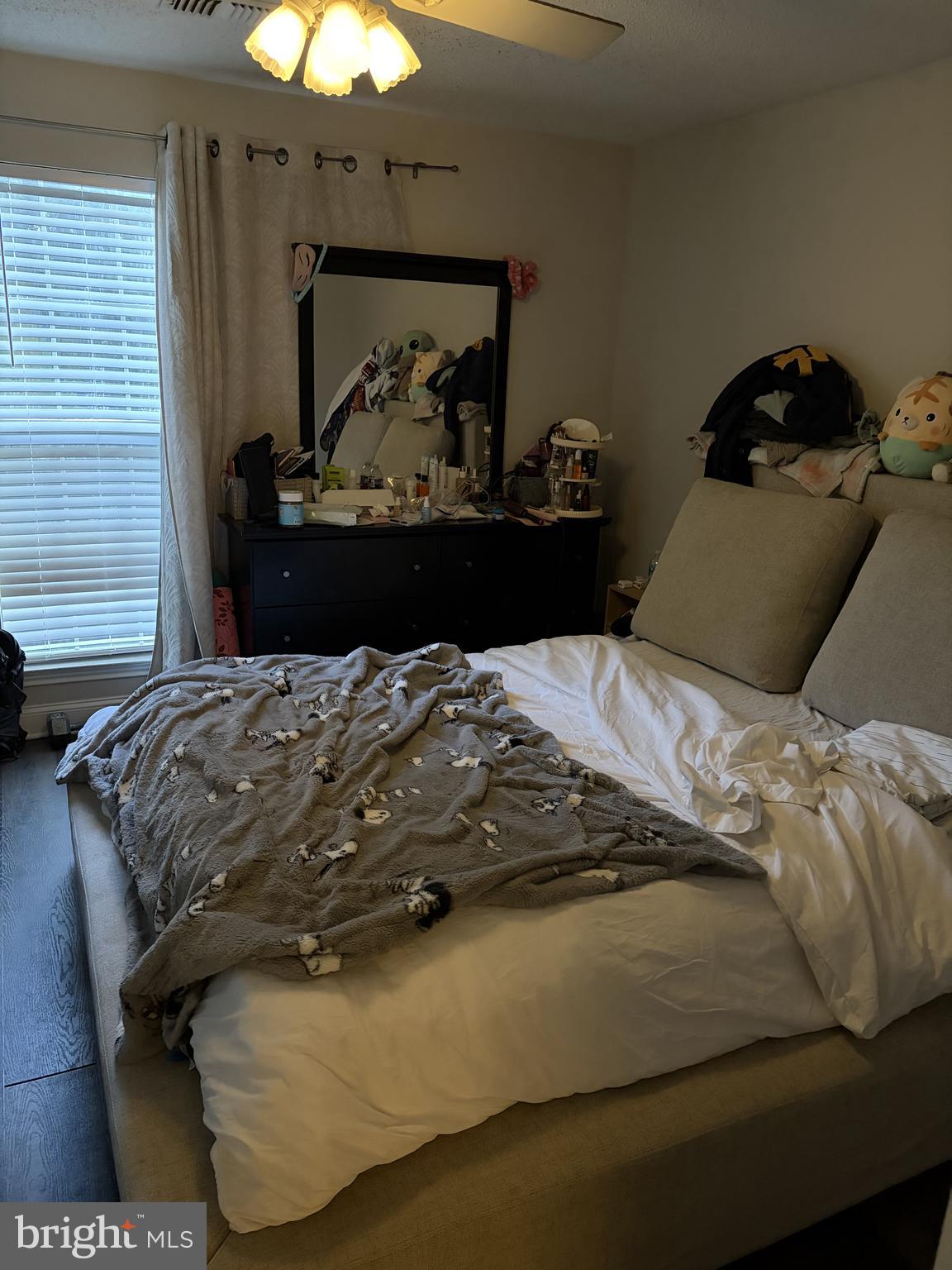 20979 Timber Ridge Terrace, Unit 204 Ashburn, VA 20147 - Photo 3 of 6 a bedroom with a bed and window