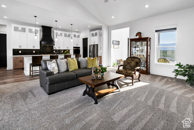 1952 Highway 118 Monroe, UT 84754 - Photo 33 of 88 Carpeted living room featuring recessed lighting and vaulted ceiling