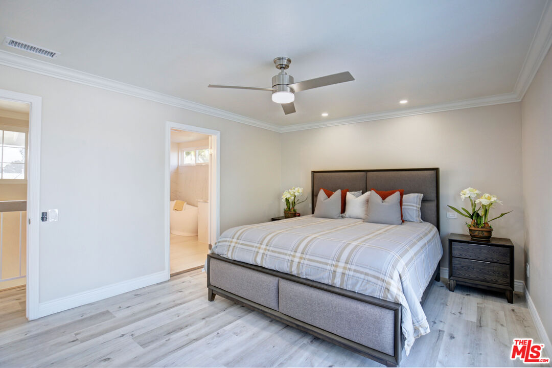 33051 Daniel Drive Dana Point, CA 92629 - Photo 12 of 30 a bedroom with a bed a dresser and a potted plant