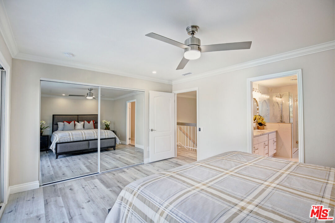 33051 Daniel Drive Dana Point, CA 92629 - Photo 13 of 30 a bedroom with a bed and a chandelier