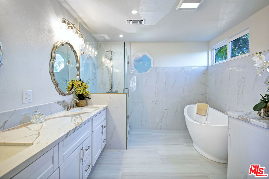 33051 Daniel Drive Dana Point, CA 92629 - Photo 14 of 30 a bathroom with a sink a toilet and bathtub