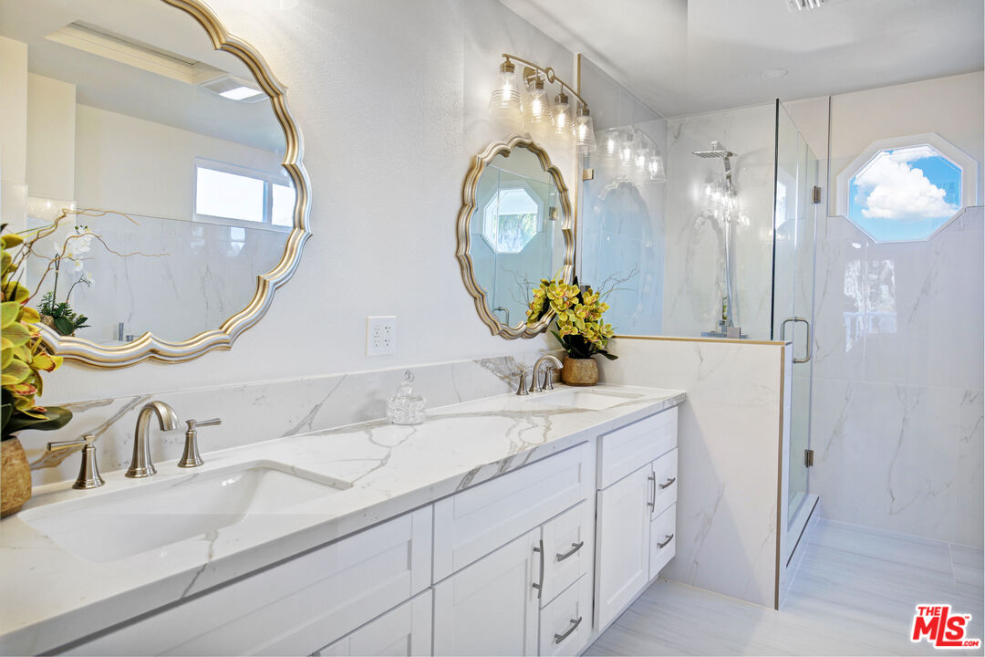 33051 Daniel Drive Dana Point, CA 92629 - Photo 15 of 30 a bathroom with a sink a mirror and a shower curtain