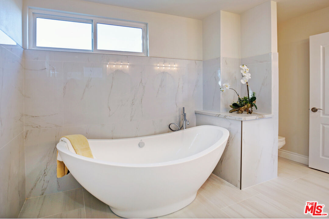 33051 Daniel Drive Dana Point, CA 92629 - Photo 17 of 30 a white bath tub sitting in a bathroom