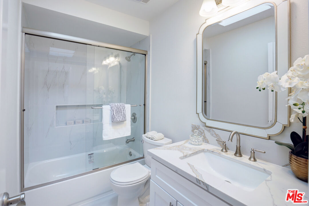 33051 Daniel Drive Dana Point, CA 92629 - Photo 20 of 30 a bathroom with a granite countertop sink toilet and shower