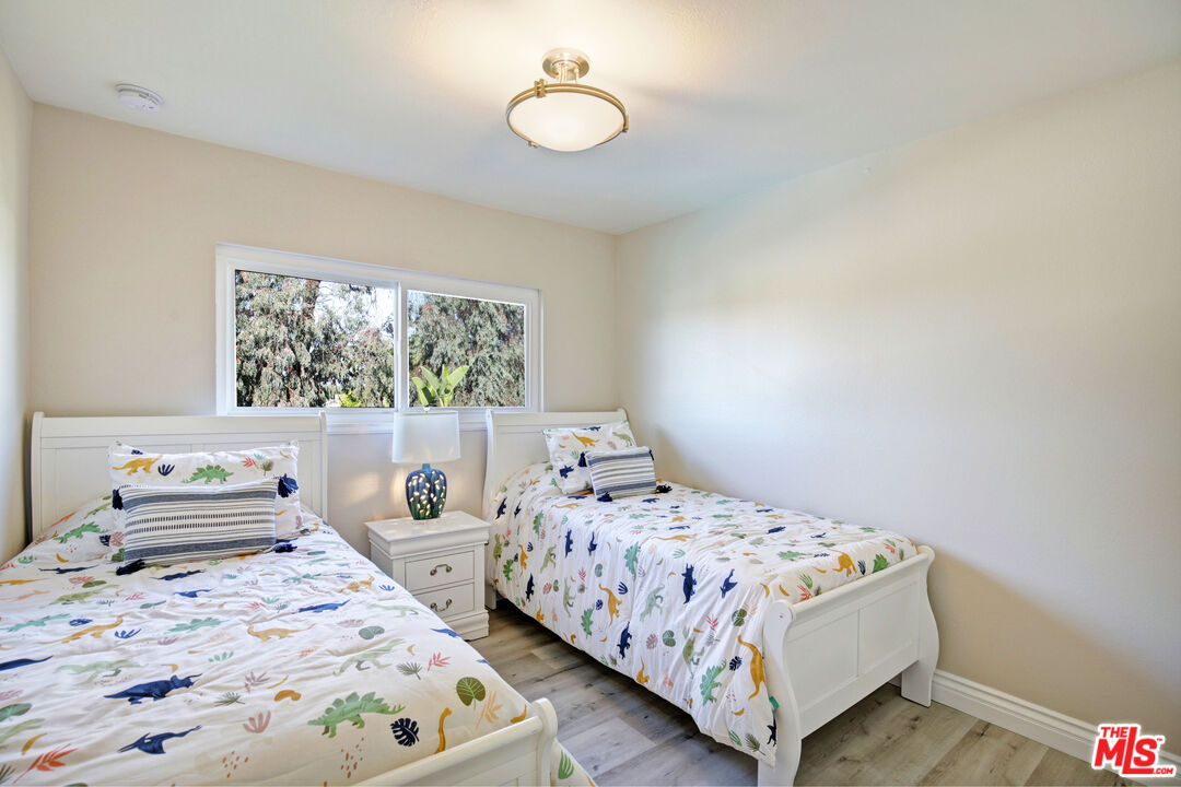 33051 Daniel Drive Dana Point, CA 92629 - Photo 21 of 30 a bedroom with two beds and a large window