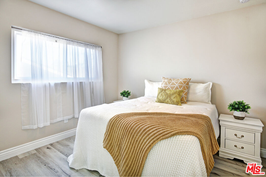 33051 Daniel Drive Dana Point, CA 92629 - Photo 22 of 30 a bedroom with a bed and a window