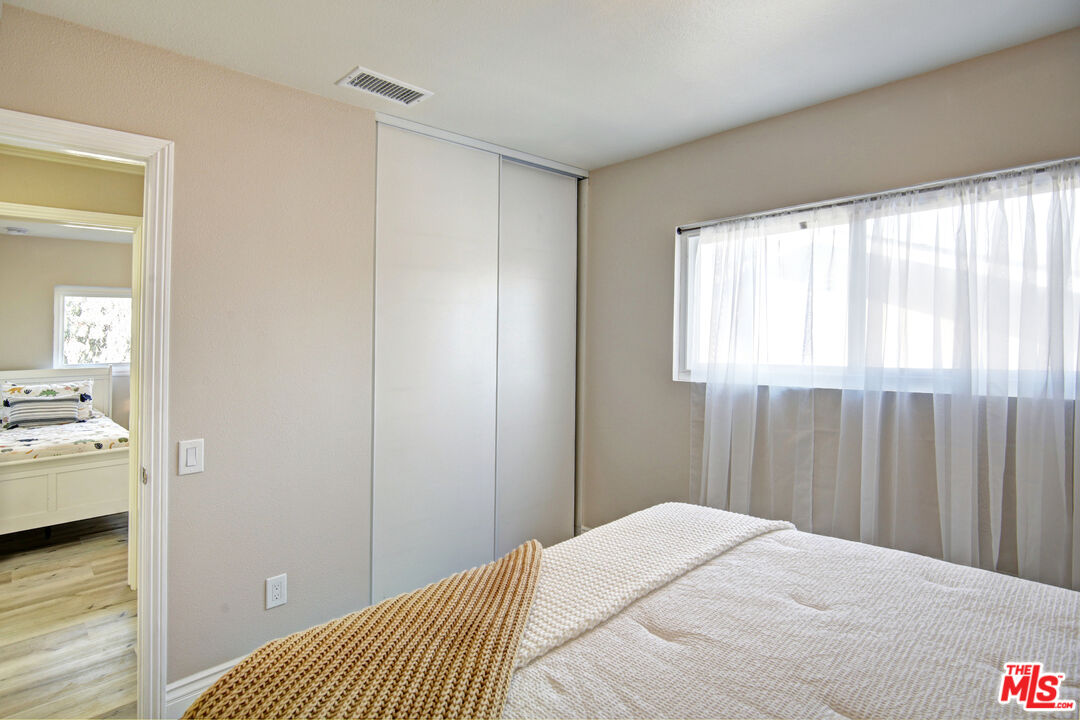 33051 Daniel Drive Dana Point, CA 92629 - Photo 23 of 30 a bedroom with a bed and a window