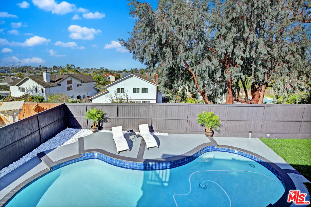 33051 Daniel Drive Dana Point, CA 92629 - Photo 24 of 30 a view of a chairs and table in the back yard of the house