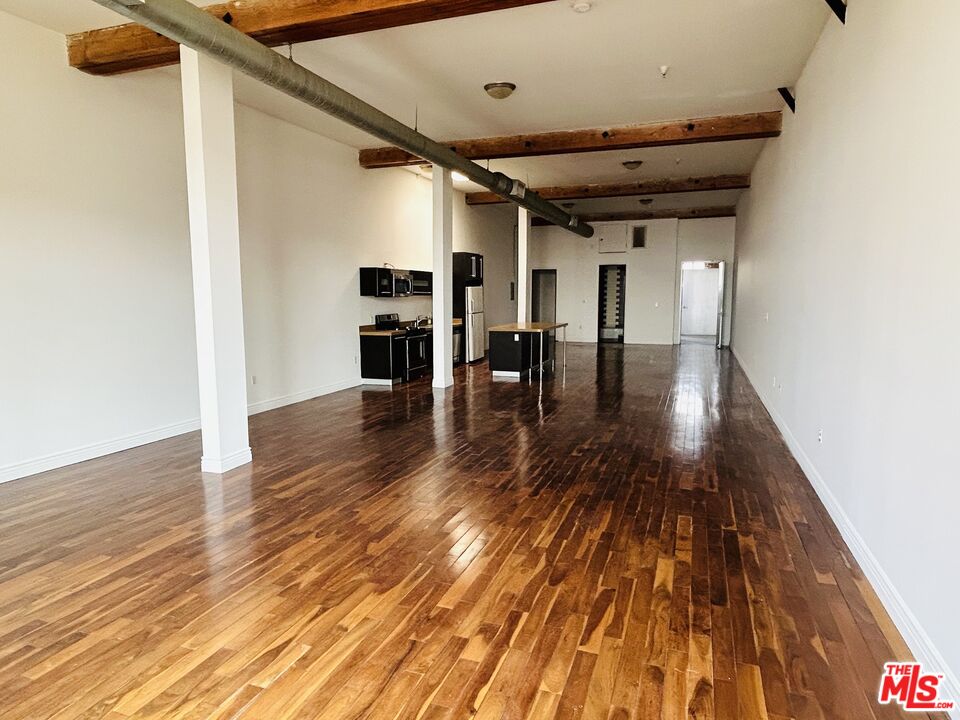 652 Mateo Street, Unit 306 Los Angeles, CA 90021 - Photo 4 of 7 a view of dining room with wooden floor