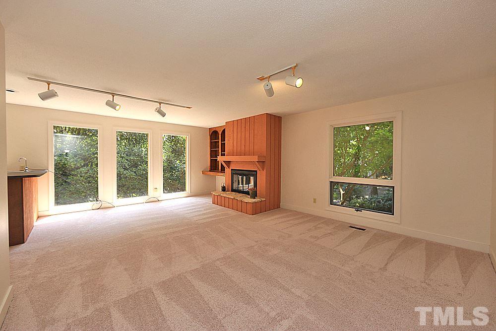 5120 Bartons Road Raleigh, NC 27613 - Photo 12 of 26 Family room w/ fireplace and bar.