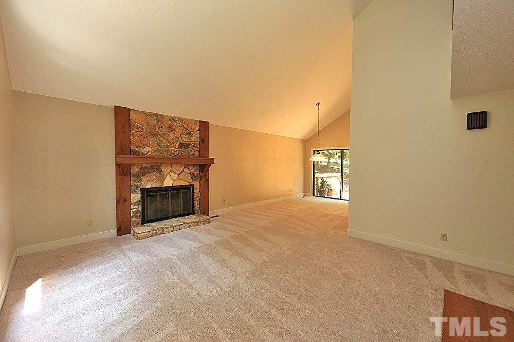 5120 Bartons Road Raleigh, NC 27613 - Photo 3 of 26 Stone façade fireplace in living room