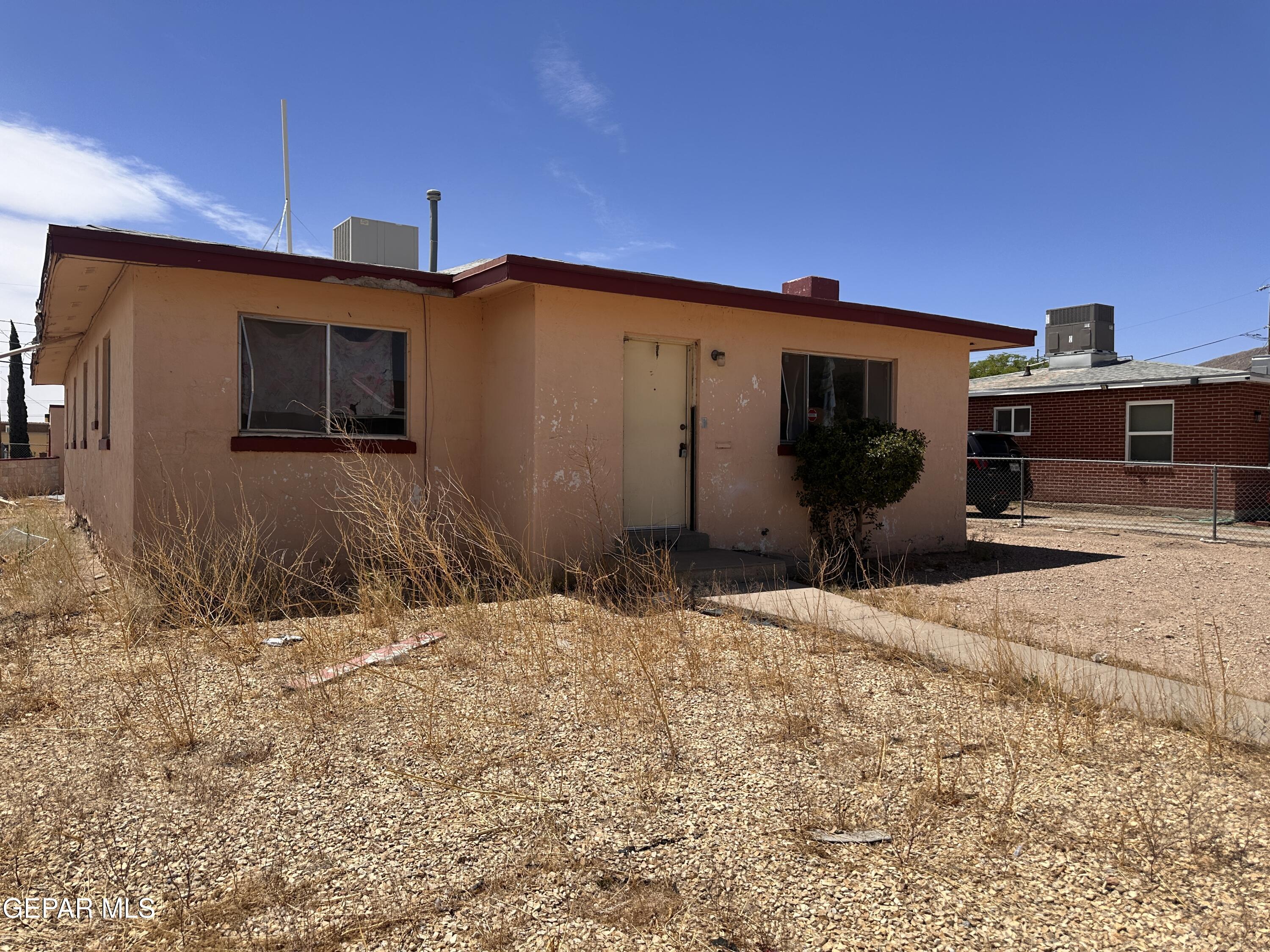 9220 Raleigh Drive El Paso, TX 79924 - Photo 6 of 6 a front view of a house with a yard