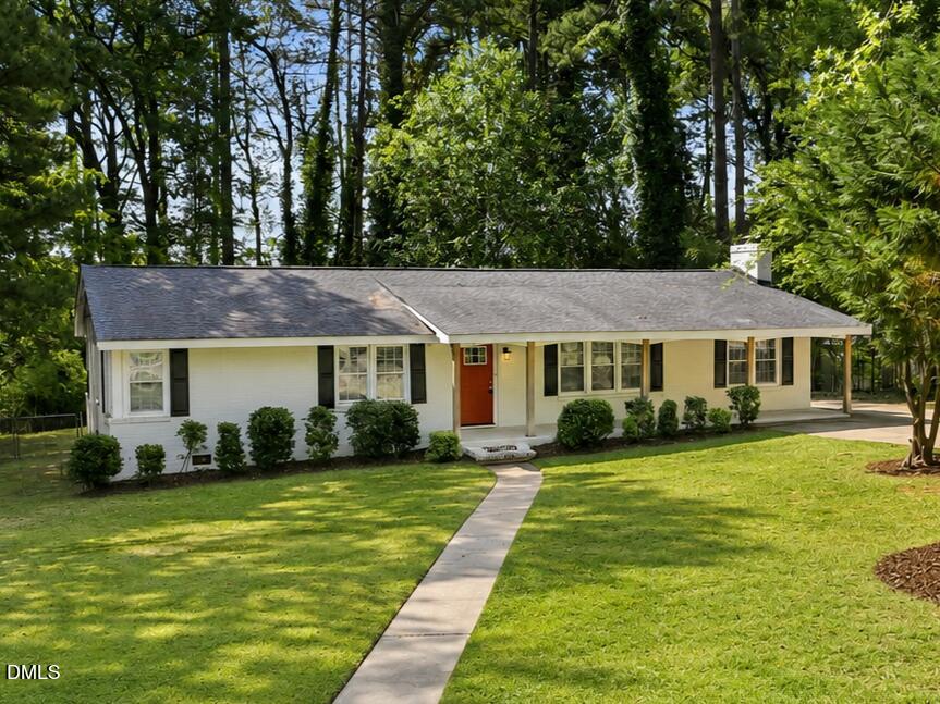 2950 Glenridge Drive Raleigh, NC 27604 - Photo 2 of 53 a front view of a house with garden