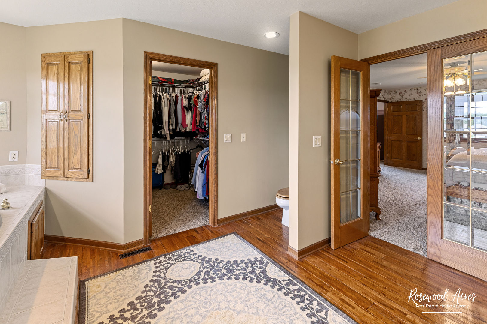 2021 Wiley Ridge Road Kankakee, IL 60901 - Photo 20 of 32 a view of a hallway with bedroom and wooden floor