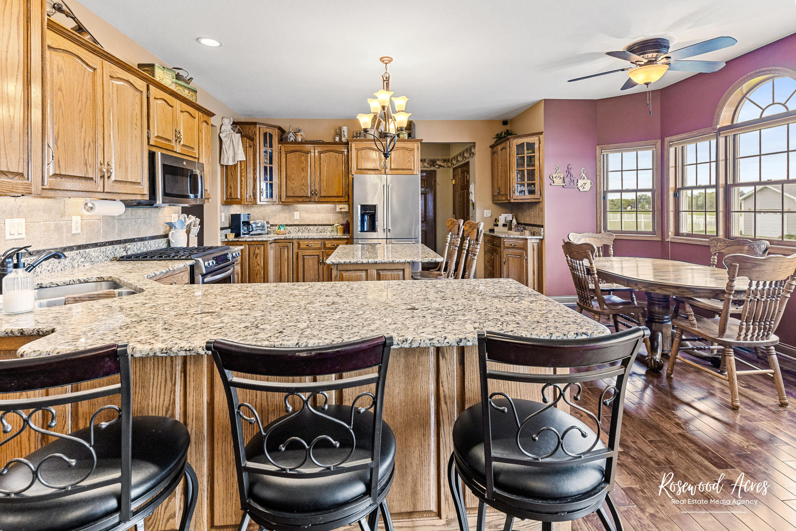 2021 Wiley Ridge Road Kankakee, IL 60901 - Photo 7 of 32 a kitchen with a stove a sink and a dining table