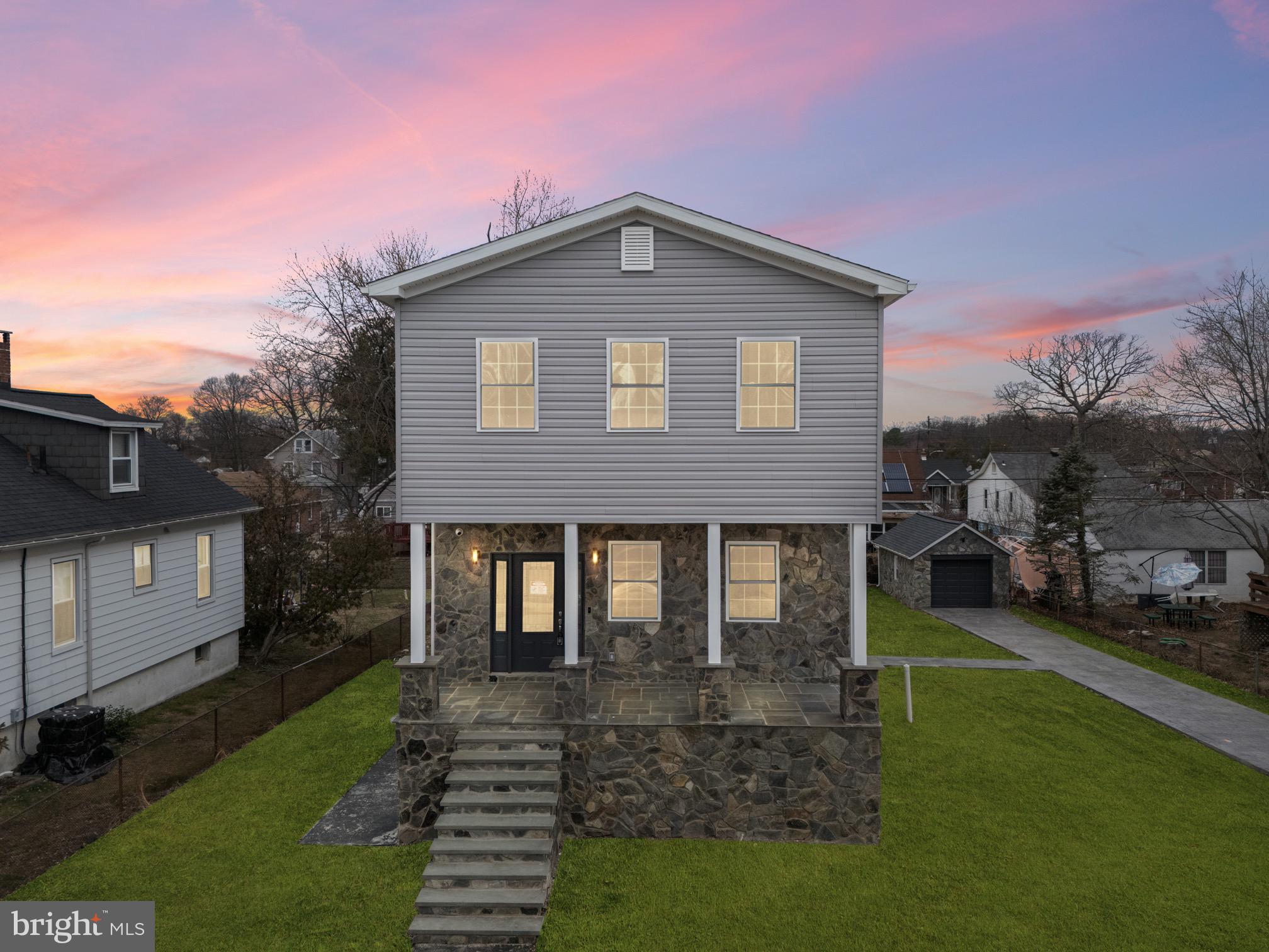 6308 Marietta Avenue Baltimore, MD 21214 - Photo 1 of 36 a front view of a house with garden