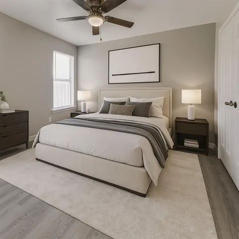 a spacious bedroom with a bed and window