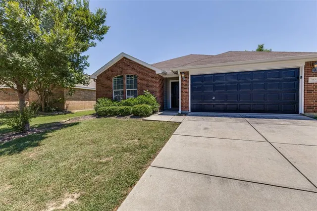 a house view with a garden space